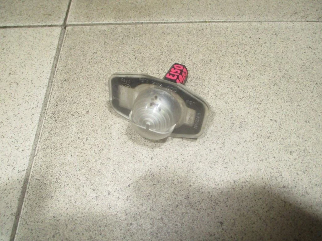 Фонарь подсветки номера Toyota Corolla E150