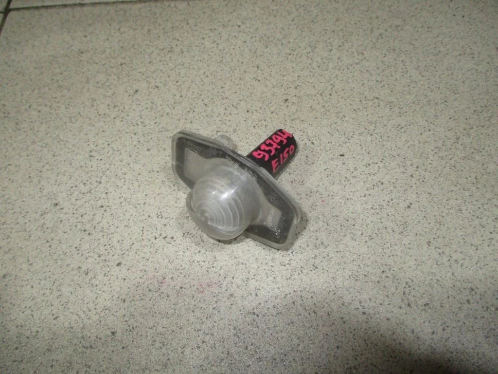 Фонарь подсветки номера Toyota Corolla E150