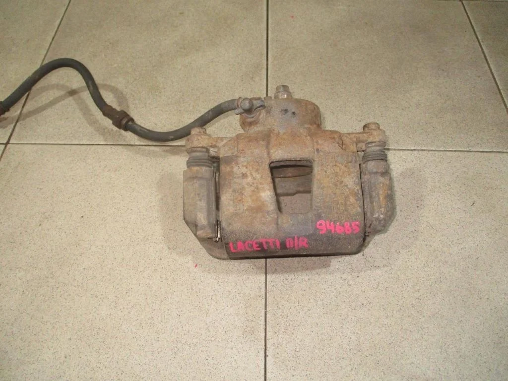 Суппорт передний правый Chevrolet Lacetti J200