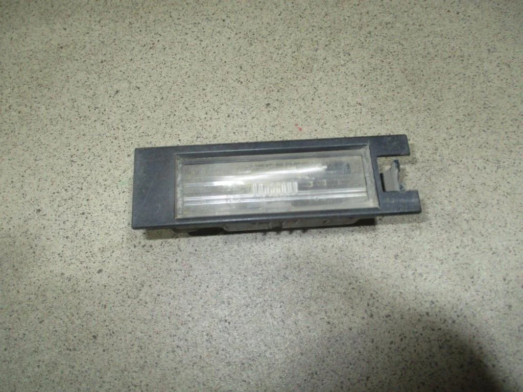 Фонарь подсветки номера Opel Vectra 2005