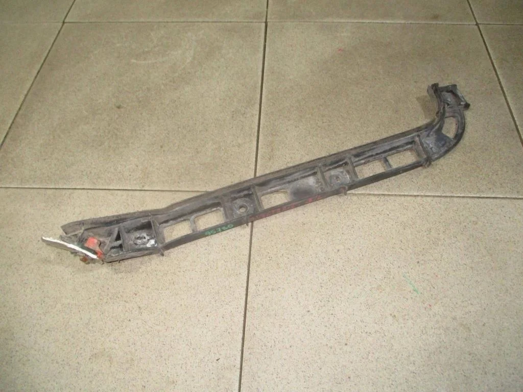 Кронштейн заднего бампера левый Opel Vectra