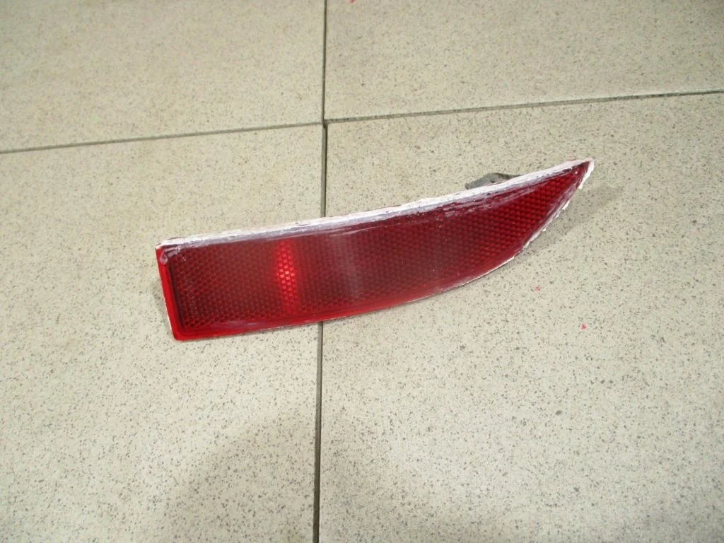 Отражатель в бампер задний левый Renault Logan 2 L52