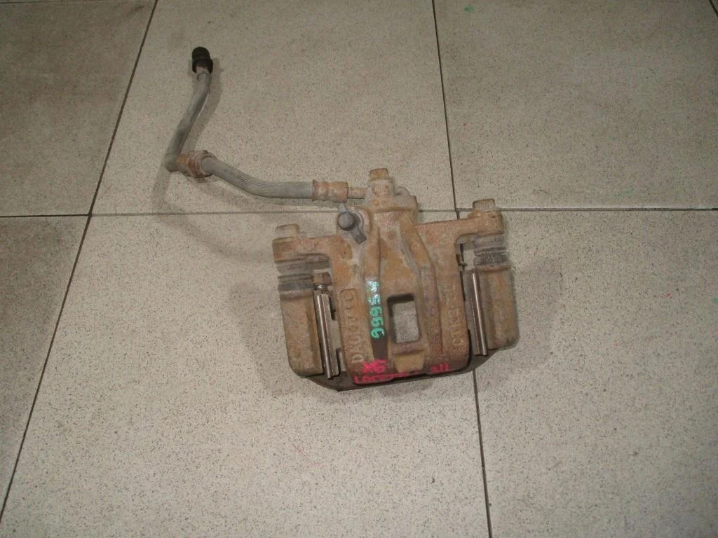 Суппорт задний левый Chevrolet Lacetti J200