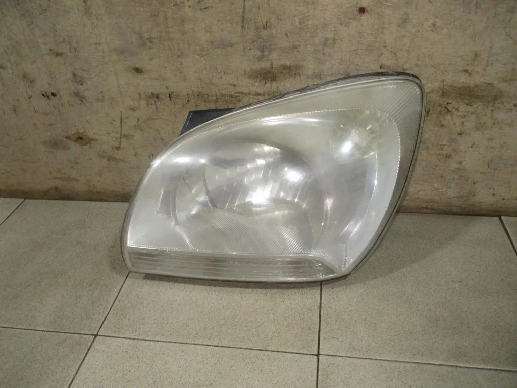 Фара левая Kia Sportage 2 2007 KM