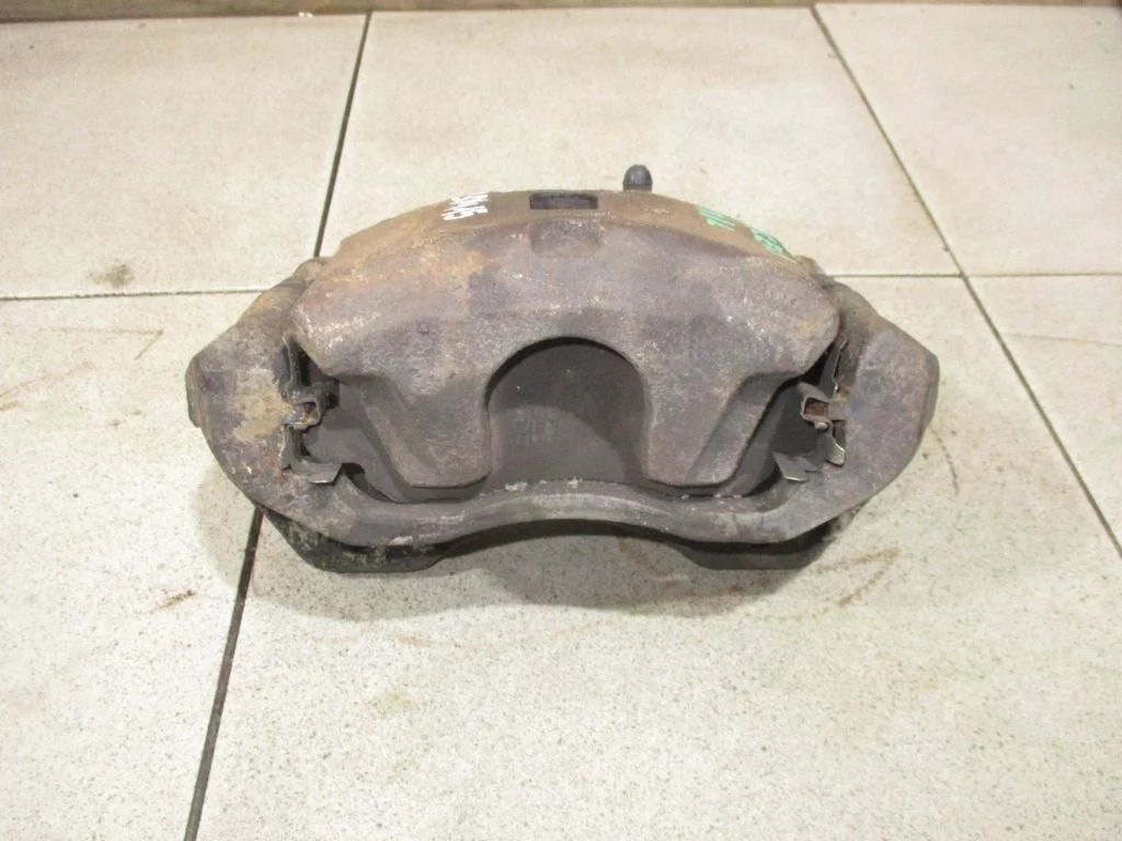 Суппорт передний левый Mitsubishi Lancer 9 CS