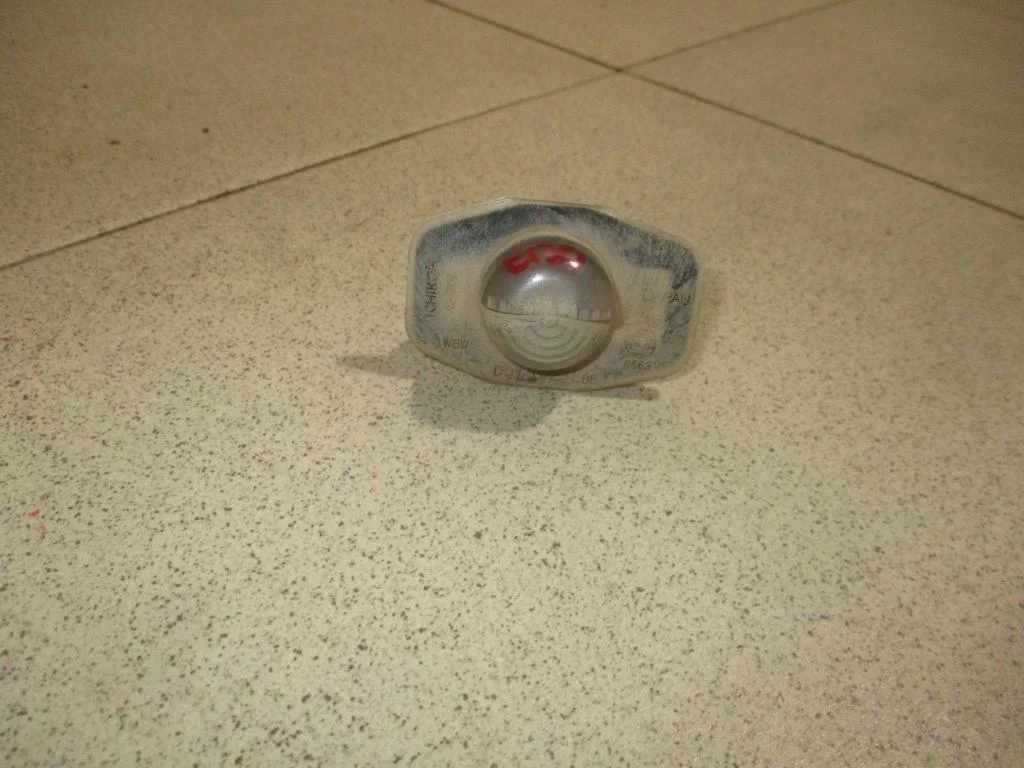 Фонарь подсветки номера Toyota Corolla E150