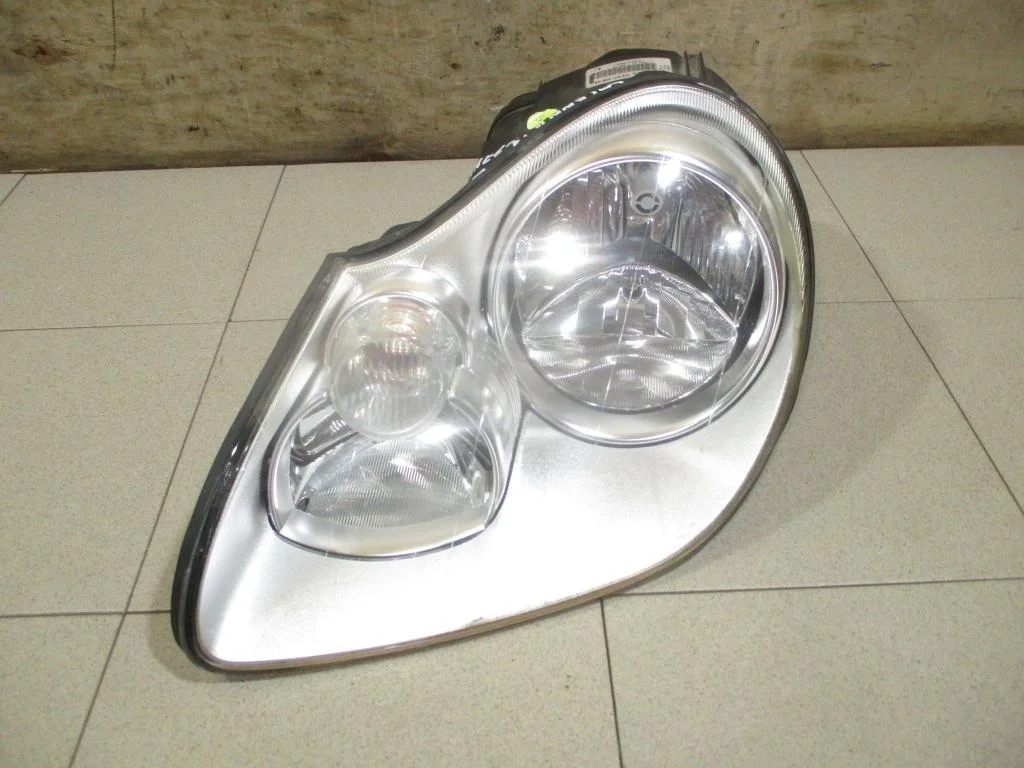 Фара левая Porsche Cayenne 1 955, 957