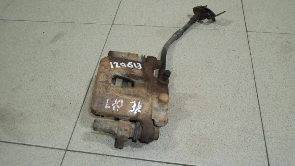 Суппорт задний левый Mitsubishi Lancer 10 CY