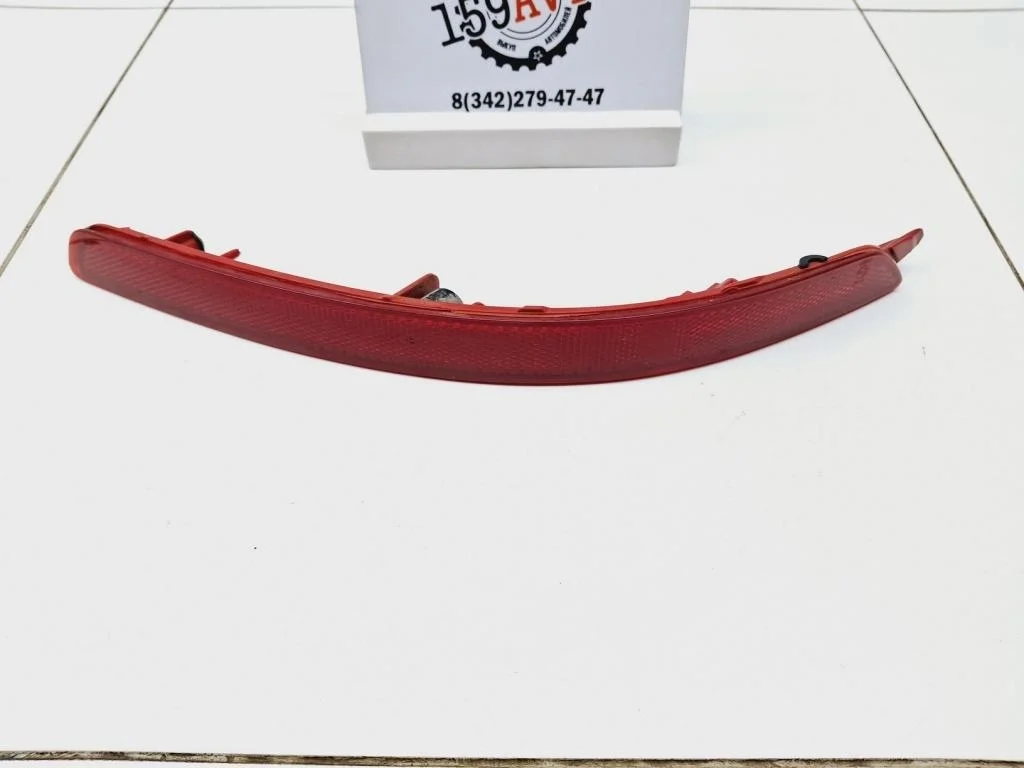 Отражатель в бампер задний левый Kia RIO 3 UB, QB