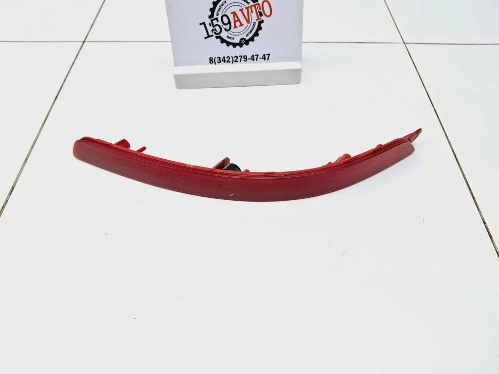 Отражатель в бампер задний левый Kia RIO 3 UB, QB