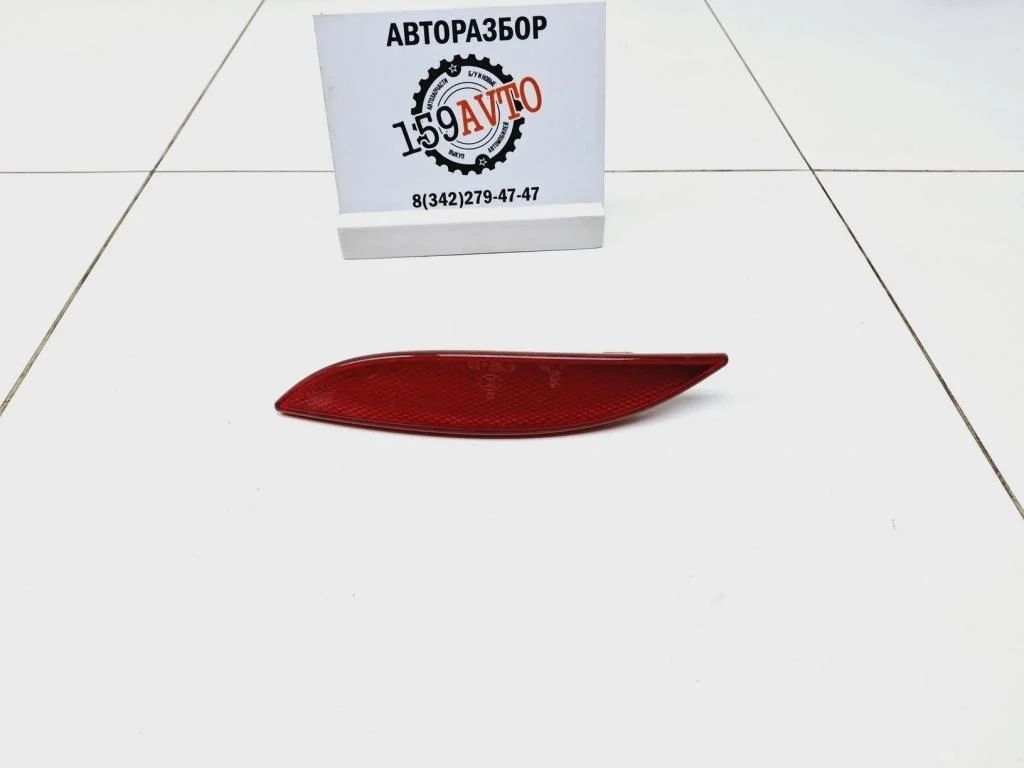 Отражатель в бампер задний левый Renault Fluence