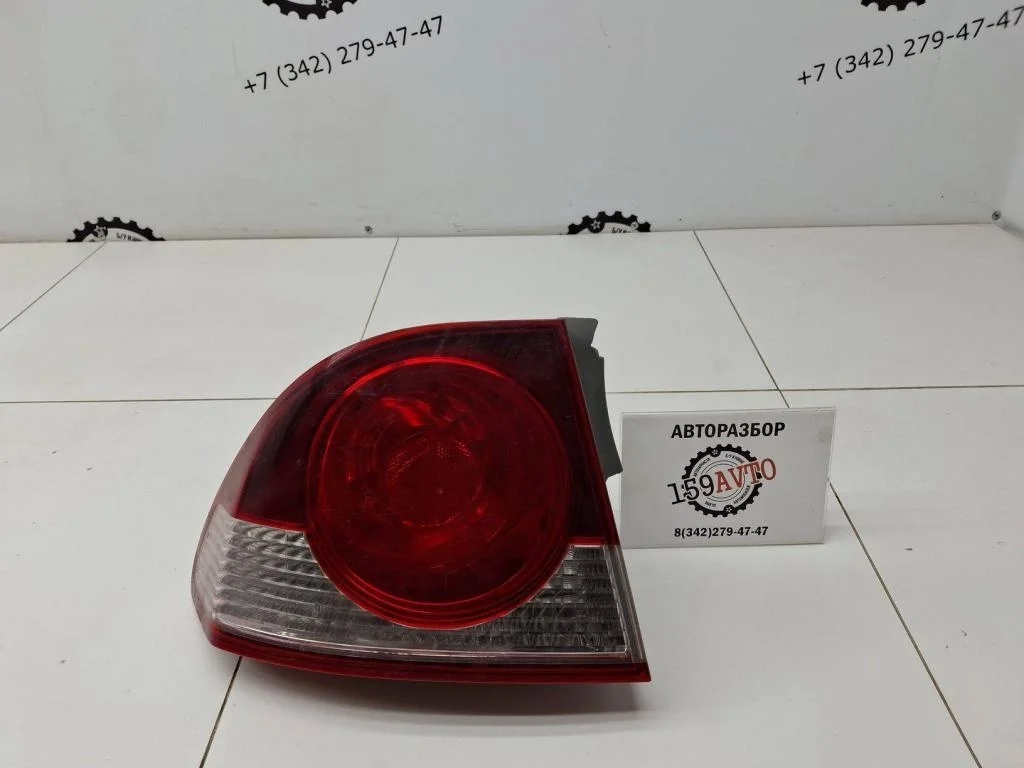 Фонарь задний наружный левый Honda Civic 4D FD