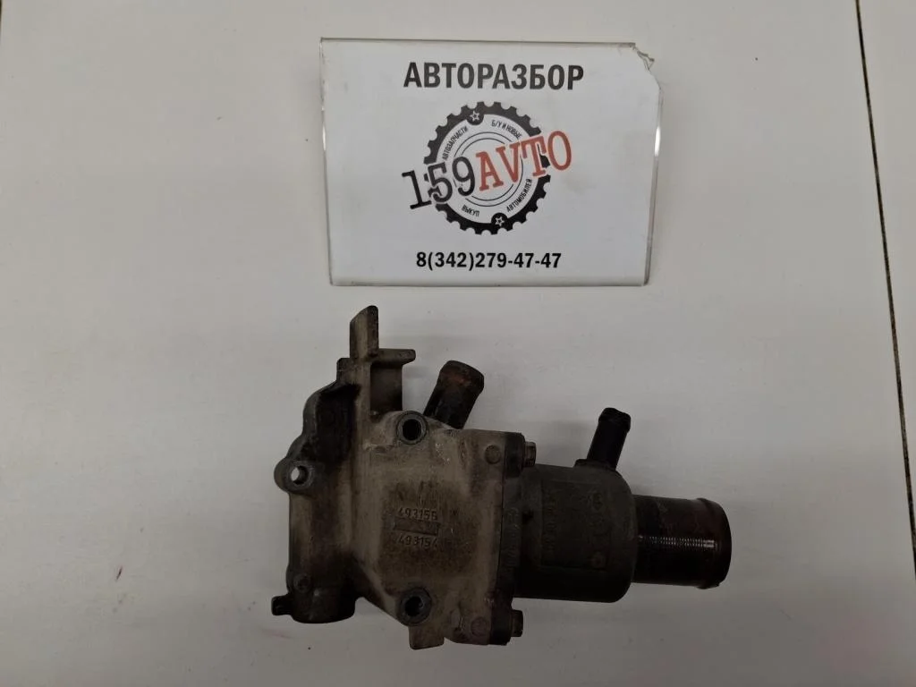 Корпус термостата Renault Logan 1 L90