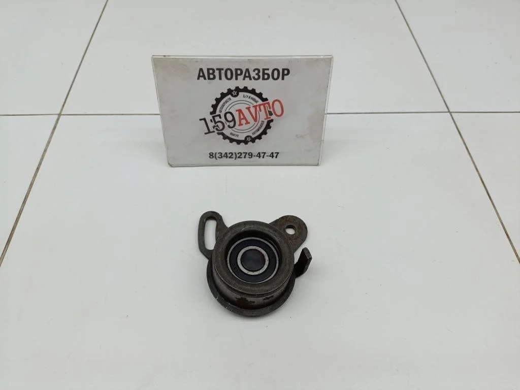 Ролик-натяжитель ремня грм Kia Cerato 1 LD