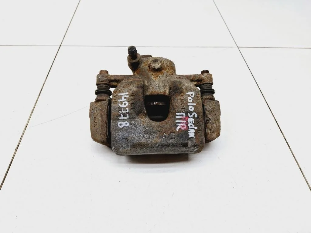 Суппорт передний правый Volkswagen Polo 5