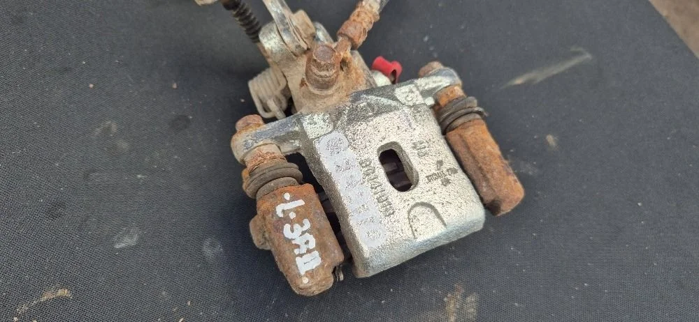 Суппорт тормозной задний левый для Kia Cerato 1