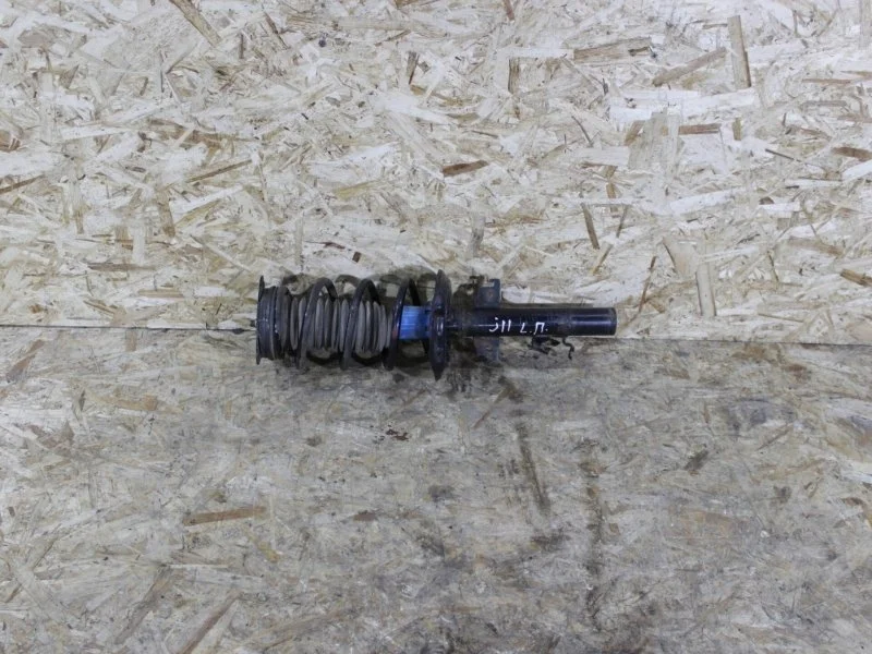 Амортизатор подвески Nissan Qashqai 2006—2010 E43034EA8C J11E, передний левый