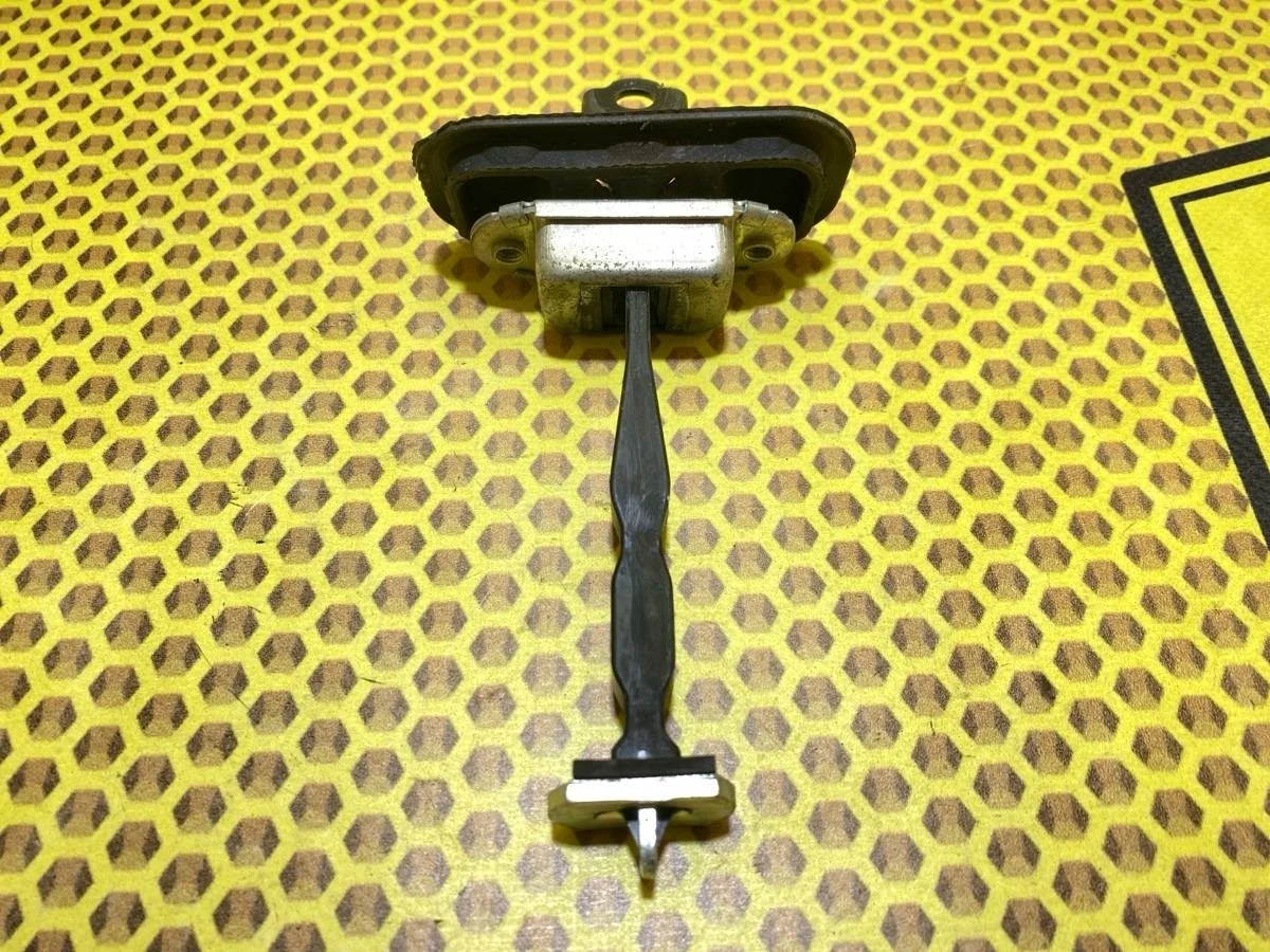 Ограничитель двери Nissan QASHQAI 82430JD000 J10, задний левый