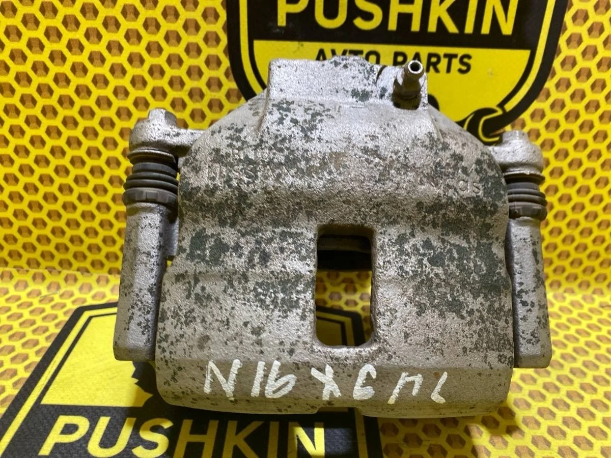 Суппорт Nissan Almera 2004 410112F522 N16 QG18DE, передний левый