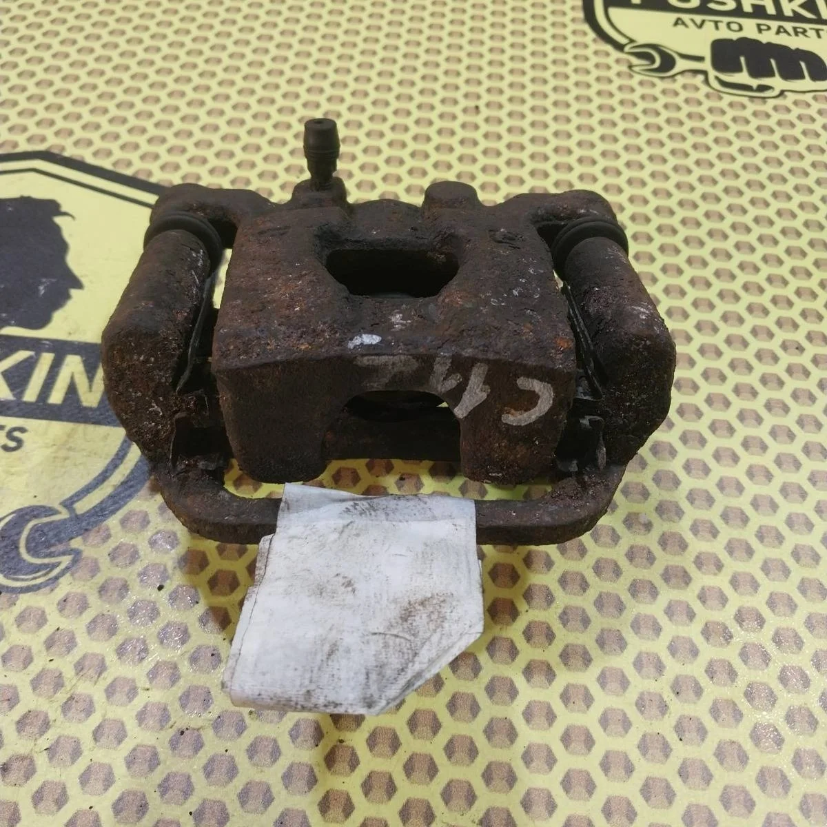 Суппорт Nissan Tiida 2009 44011EM11A SC11X, задний левый