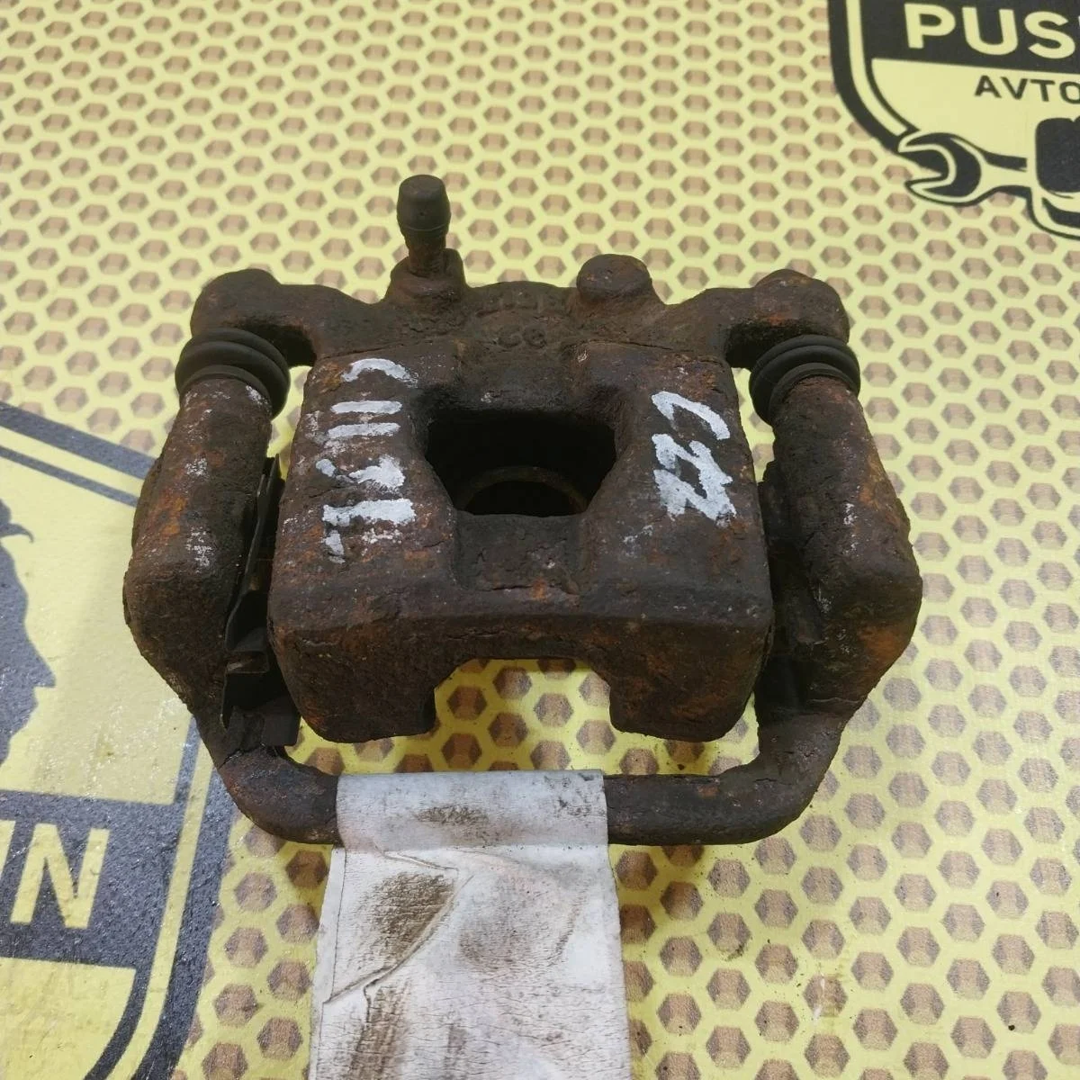 Суппорт Nissan Tiida 2009 44011EM11A SC11X, задний левый