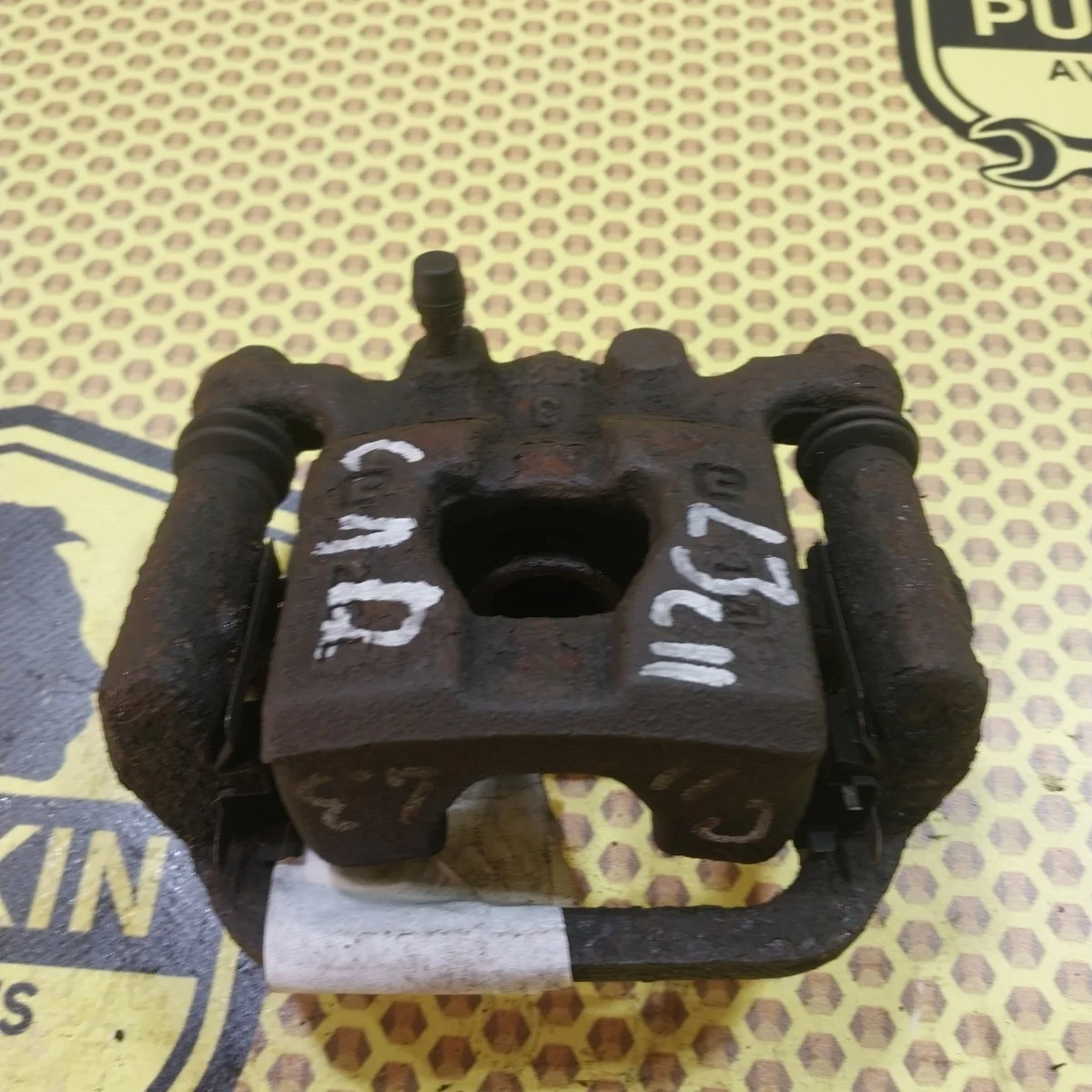 Суппорт Nissan Tiida 2009 44011EM11A SC11X, задний левый