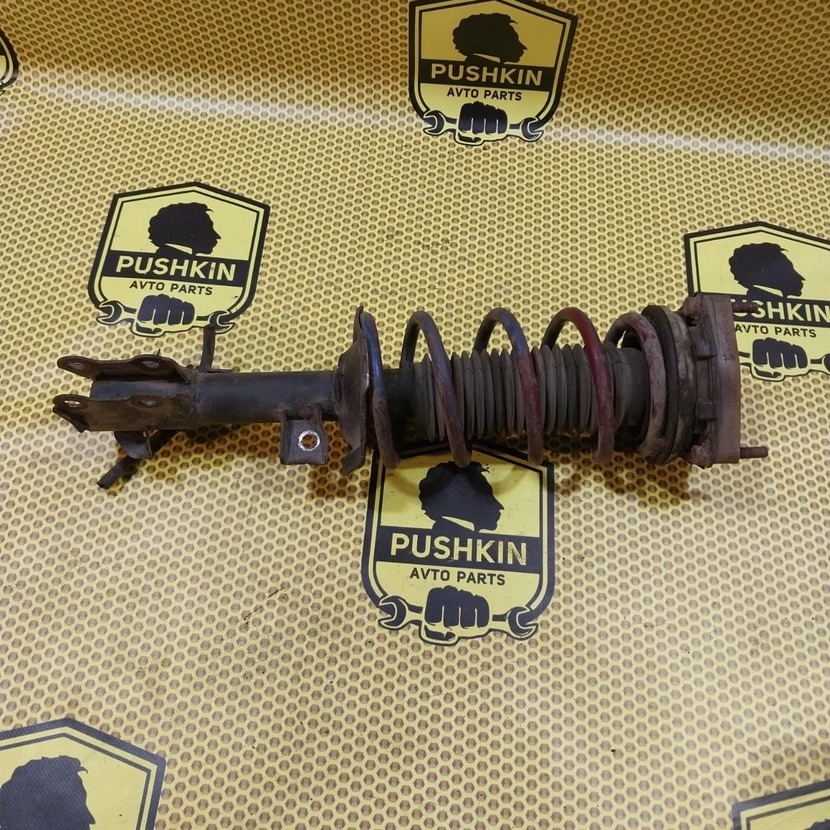 Амортизатор подвески Nissan Tiida 2009 E4303EC80A C11, передний левый