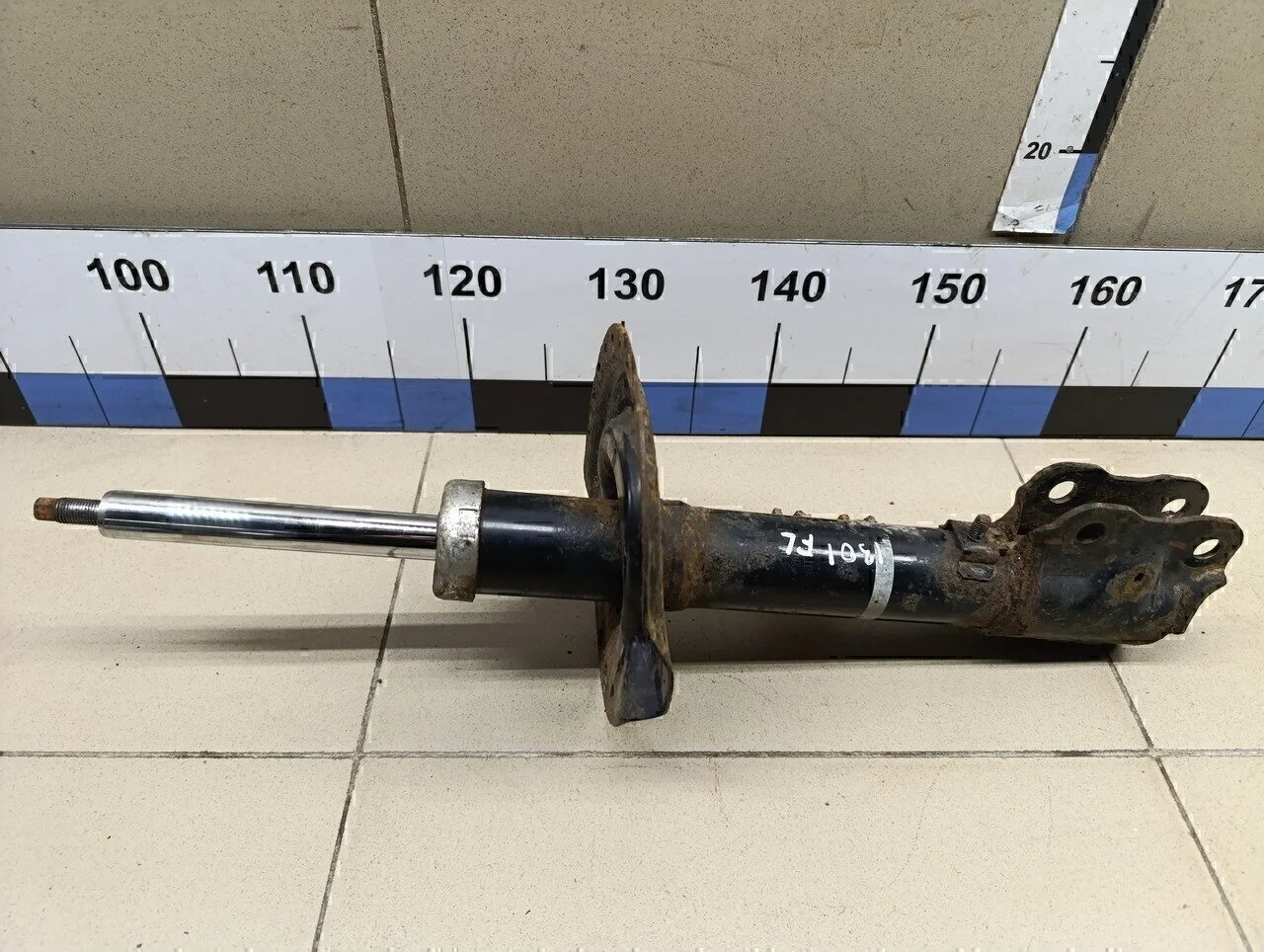 Амортизатор передний левый Outlander (GF) 2012>