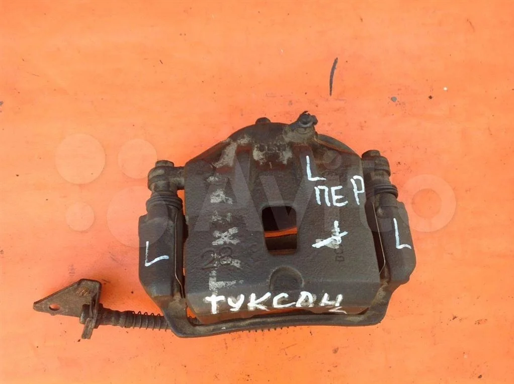 Суппорт тормозной передний левый Hyundai Tucson (