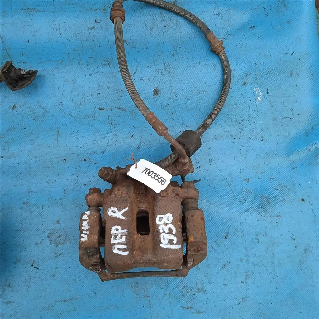 Суппорт тормозной передний правый Suzuki Grand Vi