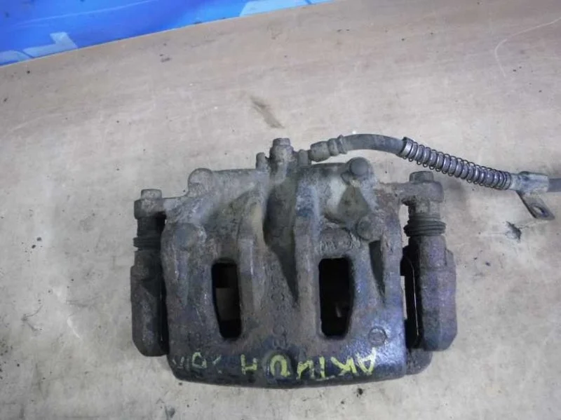 Суппорт тормозной передний левый Ssang Yong Actyon