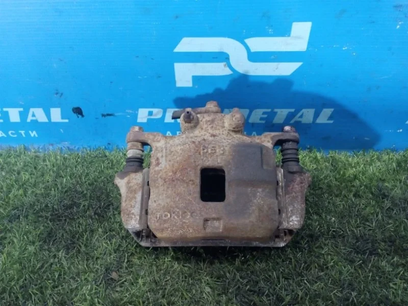 Суппорт тормозной передний левый Mitsubishi L200