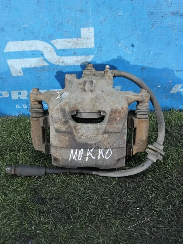 Суппорт тормозной передний левый Opel Mokka