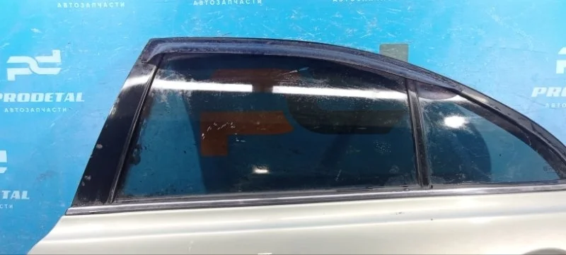 Стекло двери заднее левое Toyota Avensis 2 1ZZFE