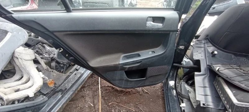 Обшивка двери задняя левая Mitsubishi Lancer 10 CY