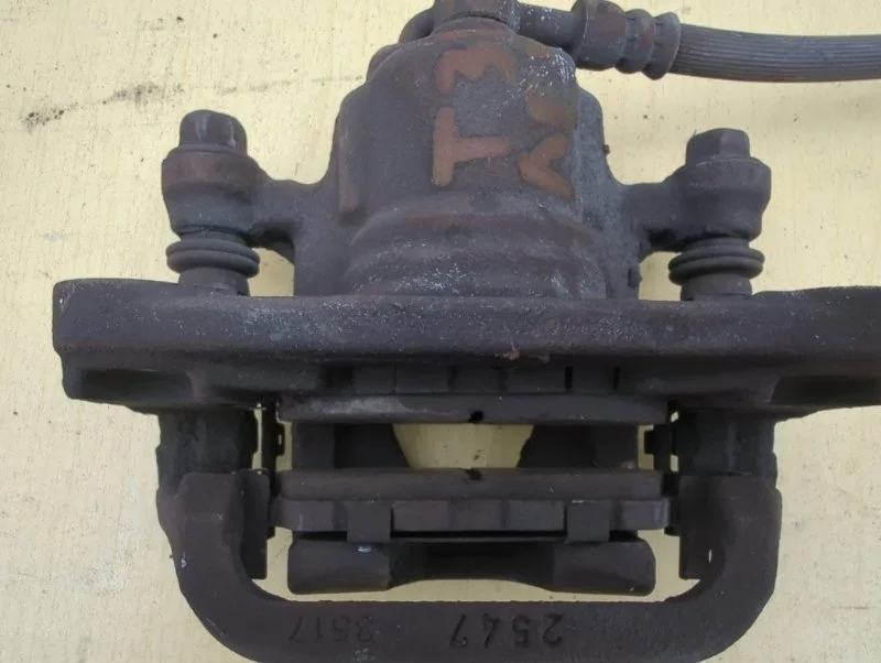 Суппорт тормозной задний левый Nissan X-Trail T31