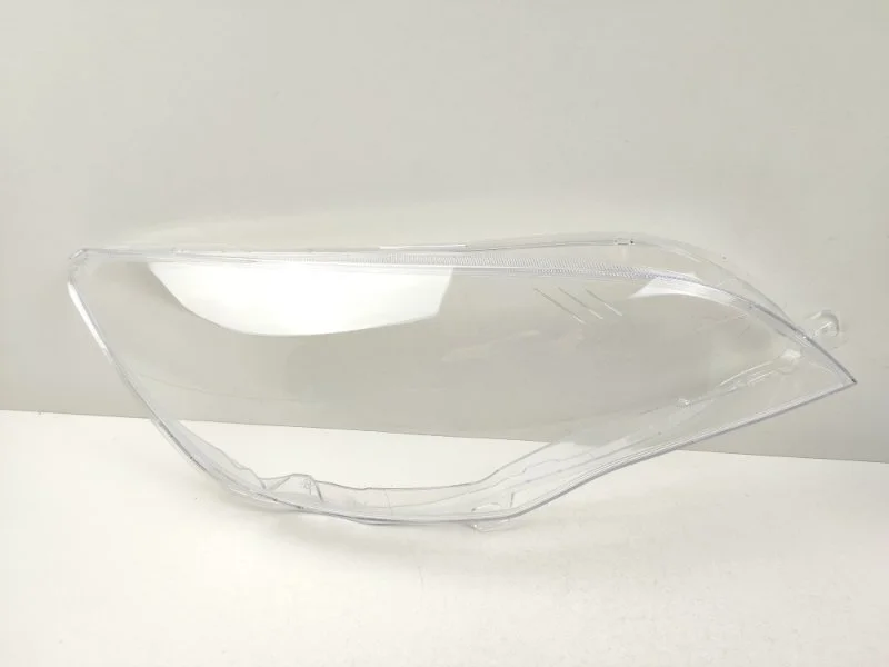 Стекло фары Opel Astra 2009-2013 13253657 J, правое