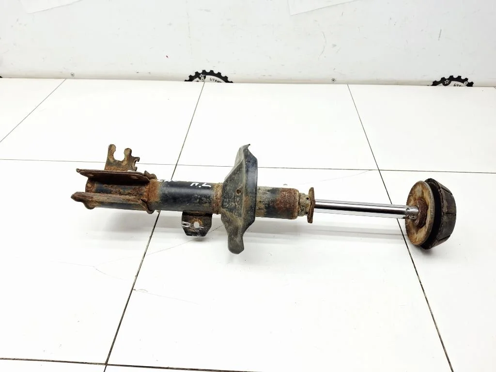 Амортизатор передний левый Chevrolet Lacetti J200