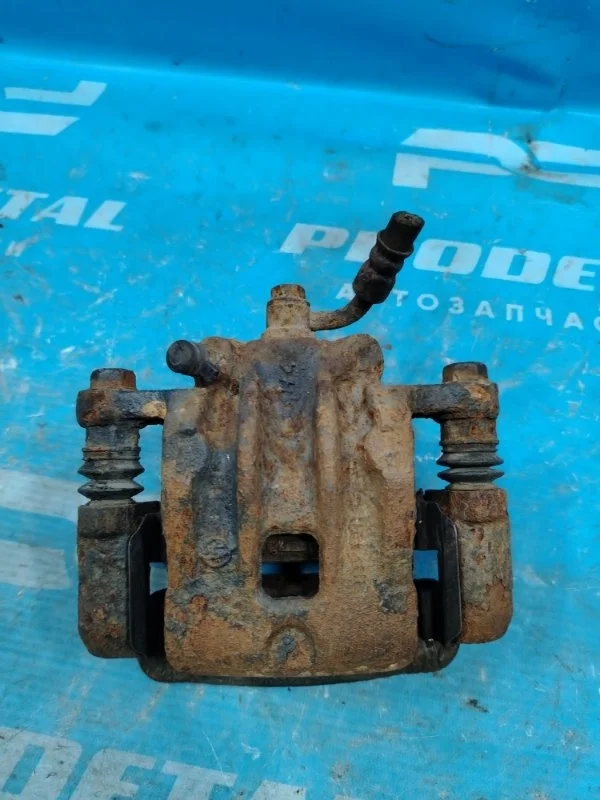 Суппорт тормозной задний левый Ssang Yong Actyon