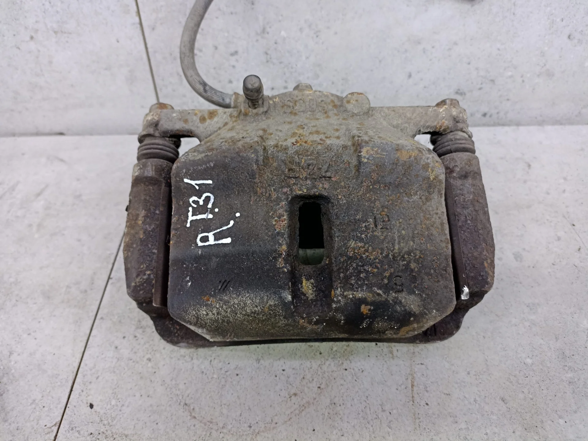 Суппорт тормозной передний правый Nissan X-Trail