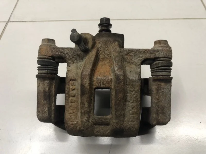 Суппорт тормозной задний левый Chevrolet Lacetti