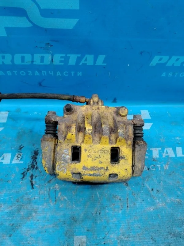 Суппорт тормозной передний левый Subaru Forester