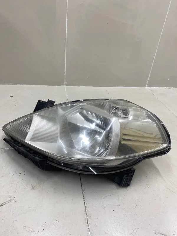 Фара левая Nissan Tiida C11