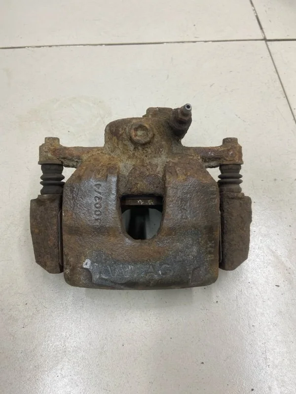 Суппорт тормозной передний левый Skoda Fabia 2