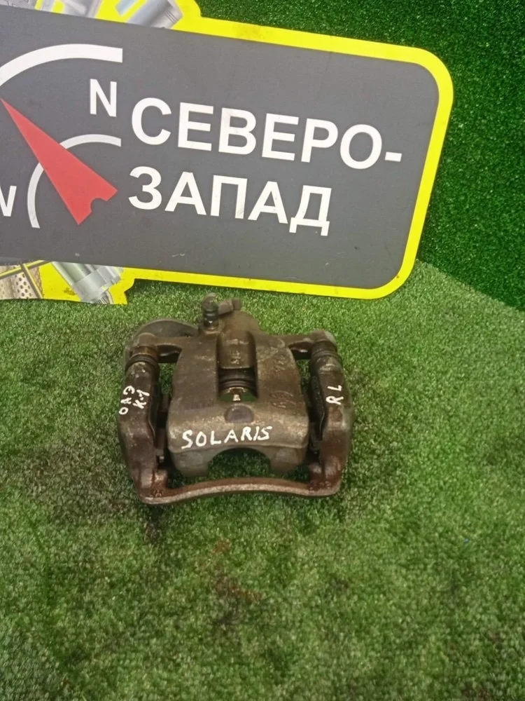 Суппорт тормозной Hyundai Solaris 2015 583001R300 RB G4FC, задний левый