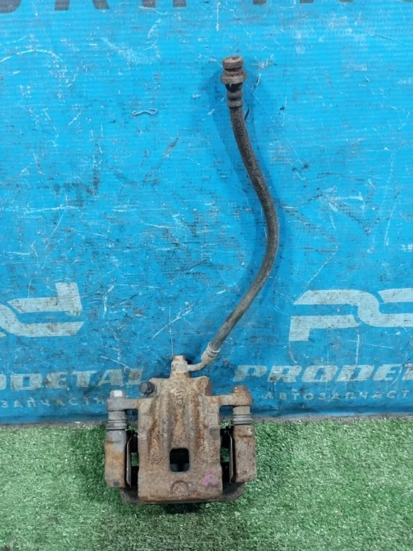 Суппорт тормозной задний левый Ssang Yong Actyon