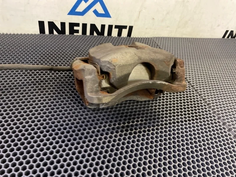 Суппорт тормозной передний правый NISSAN X-TRAIL