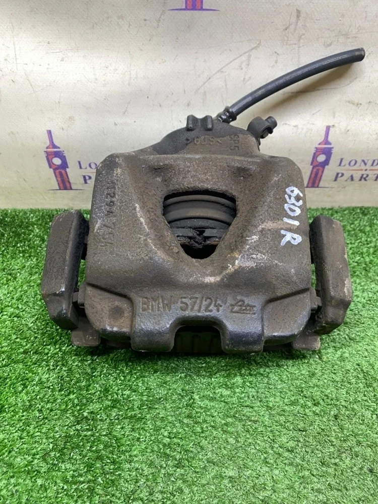 Суппорт тормозной BMW X1 E84