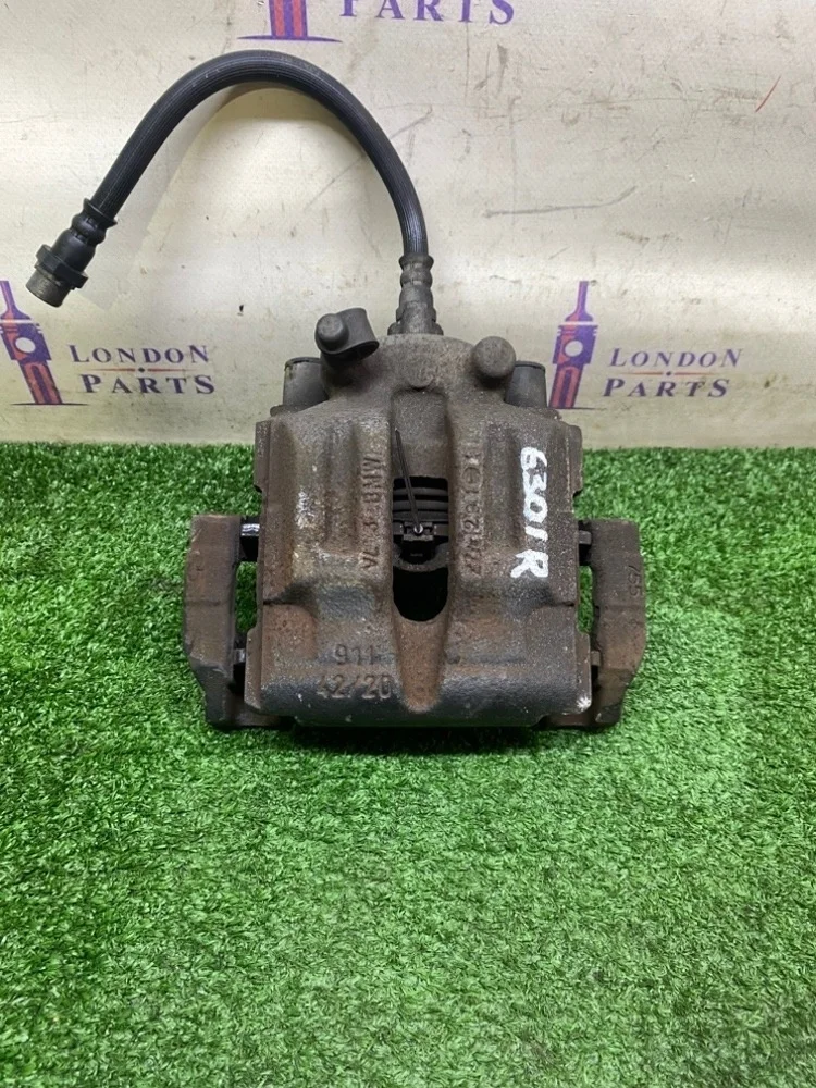 Суппорт тормозной BMW X1 E84