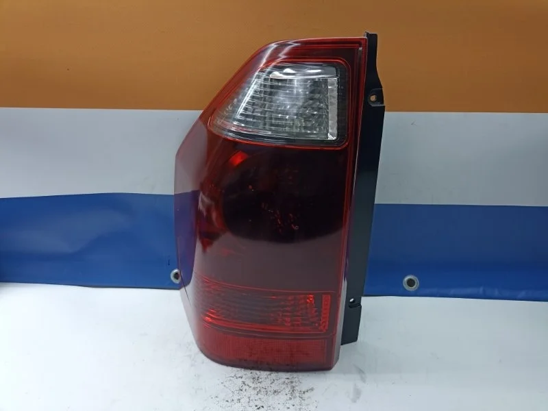 Фонарь Mitsubishi Pajero 2006 MN133765 V78W 4M41, задний левый